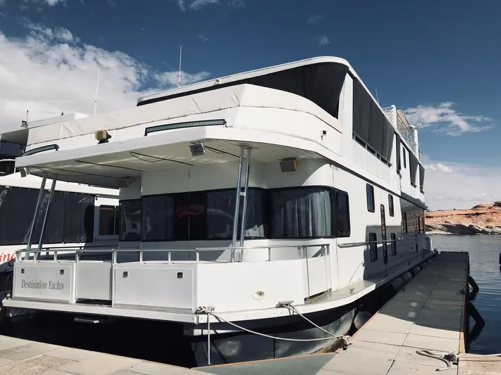 Cruisin (1/5 Share) Yacht Photos Pics 2008 Destination Yachts Cruisin houseboat docked, blue sky.