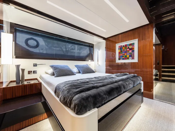  Yacht Photos Pics Luxurious bedroom interior of 2023 Riva Rivale 56 Hard Top yacht, featuring modern design and decor.