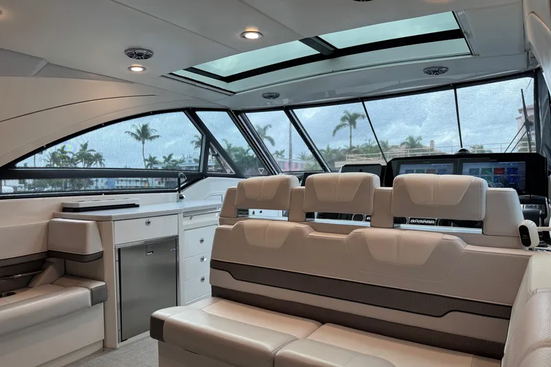 Formula Yacht Photos Pics Luxurious interior of 2023 Formula 400 Super Sport Crossover yacht with modern seating and panoramic windows.