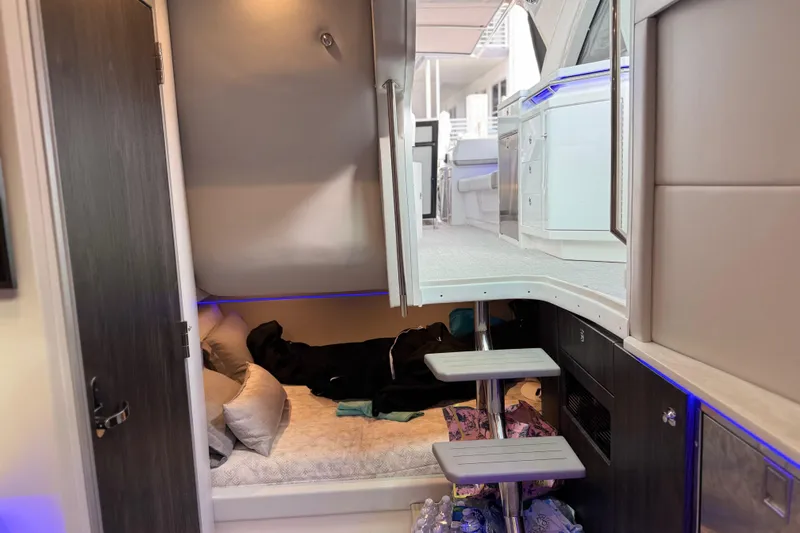 Formula Yacht Photos Pics 2023 Formula 400 Super Sport Crossover interior cabin with modern design and cozy sleeping area.