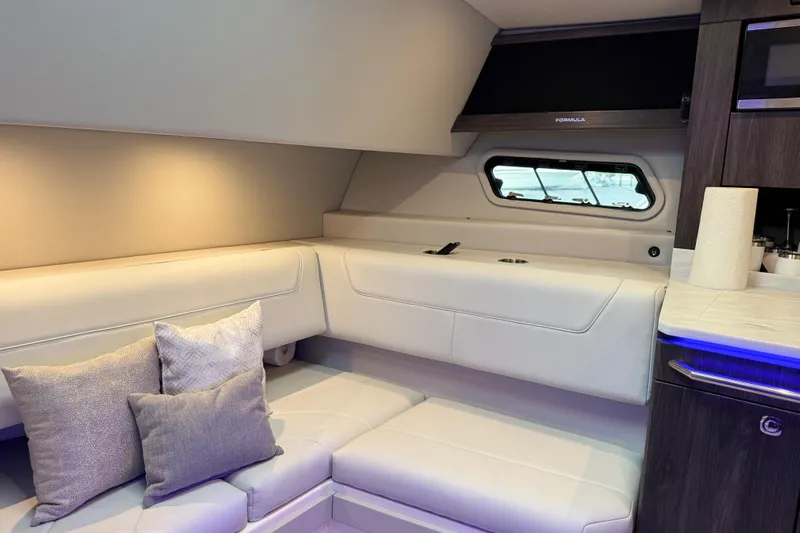 Formula Yacht Photos Pics 2023 Formula 400 Super Sport Crossover interior with white seating and modern design.