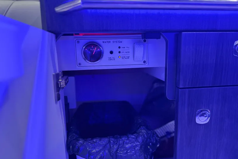 Formula Yacht Photos Pics 2023 Formula 400 Super Sport Crossover water system control panel in blue lighting.