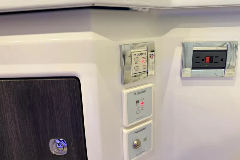 Formula Yacht Photos Pics Control panel and outlet on 2023 Formula 400 Super Sport Crossover boat interior.