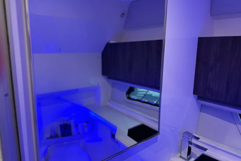 Formula Yacht Photos Pics 2023 Formula 400 Super Sport Crossover interior with modern bathroom design and blue lighting.