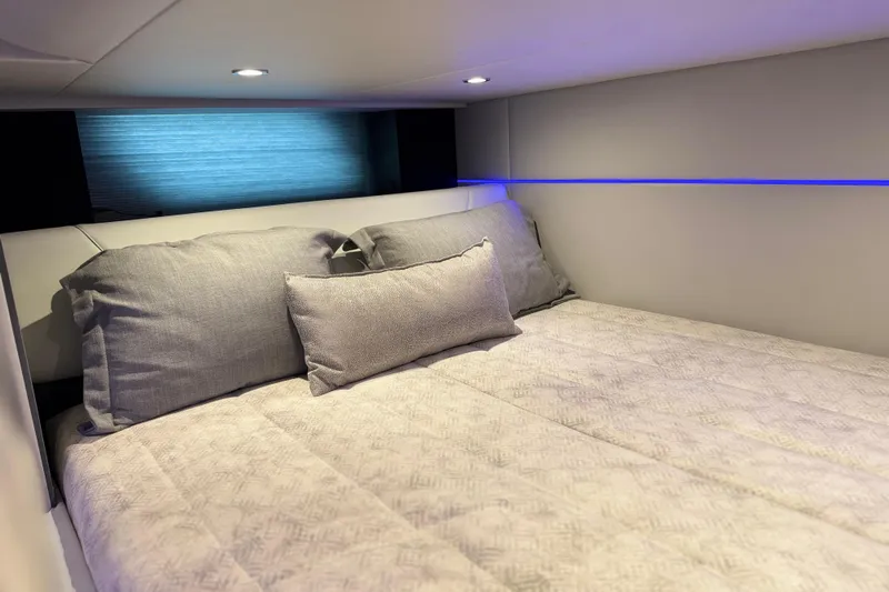 Formula Yacht Photos Pics Luxurious cabin interior of 2023 Formula 400 Super Sport Crossover with plush bedding.