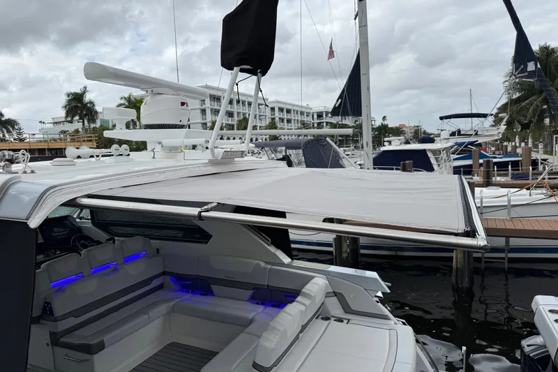 Formula Yacht Photos Pics 2023 Formula 400 Super Sport Crossover yacht with extended canopy at marina.