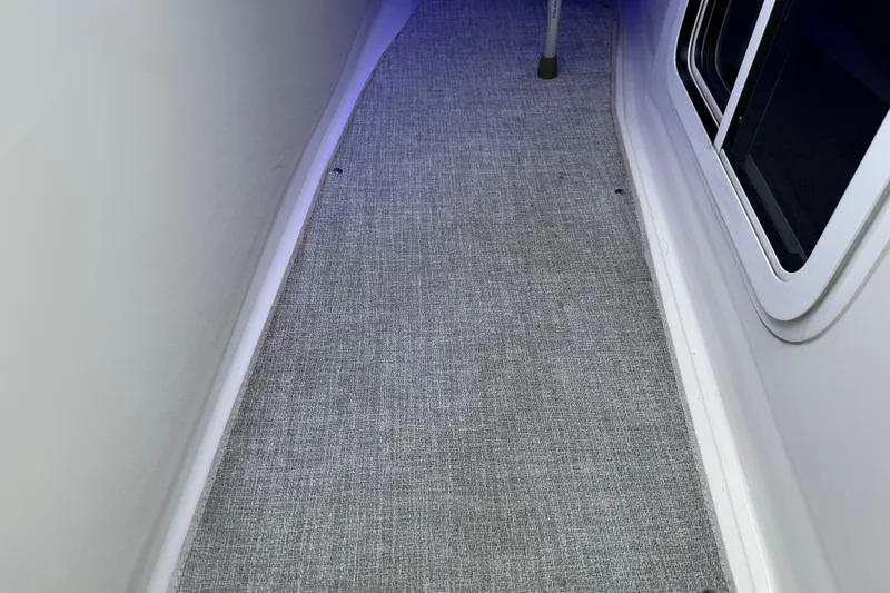 Formula Yacht Photos Pics 2023 Formula 400 Super Sport Crossover interior walkway with carpet and window.