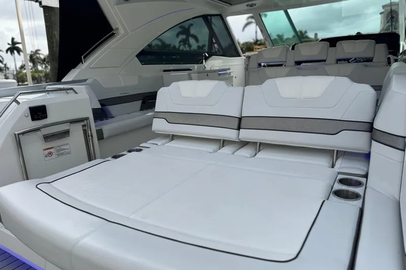 Formula Yacht Photos Pics 2023 Formula 400 Super Sport Crossover interior with luxurious white seating and cup holders.