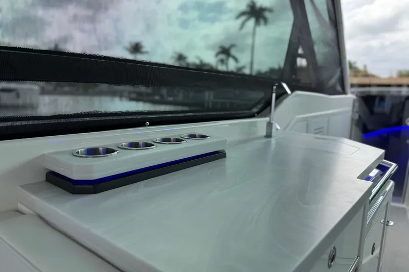 Formula Yacht Photos Pics 2023 Formula 400 Super Sport Crossover boat interior with sleek countertop and cup holders.