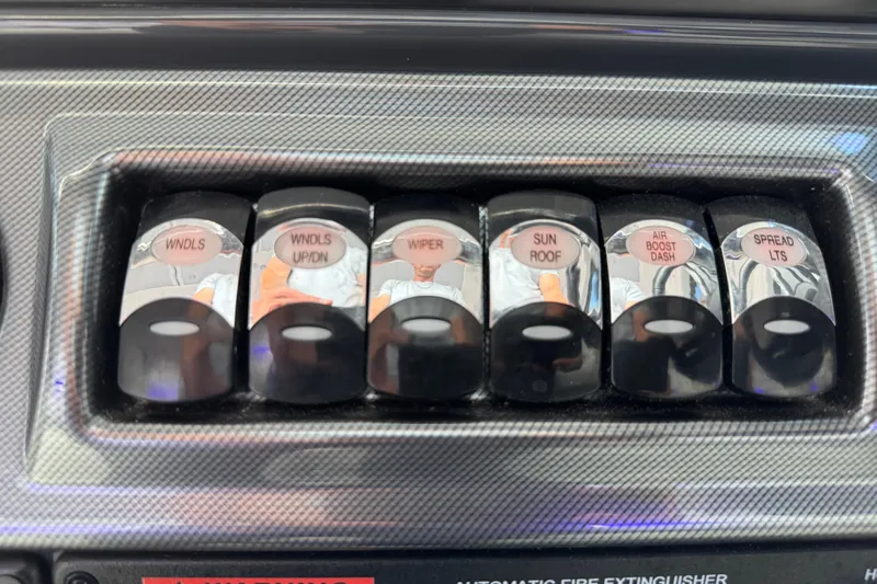 Formula Yacht Photos Pics Control panel switches on a 2023 Formula 400 Super Sport Crossover boat dashboard.