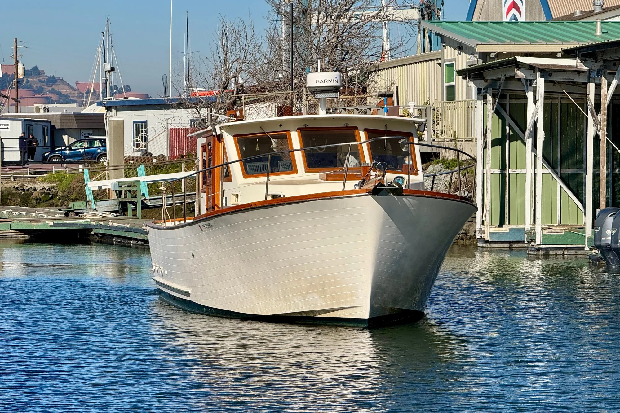1982 Tung Hwa Seahorse boat docked at a marina, clear sunny day.