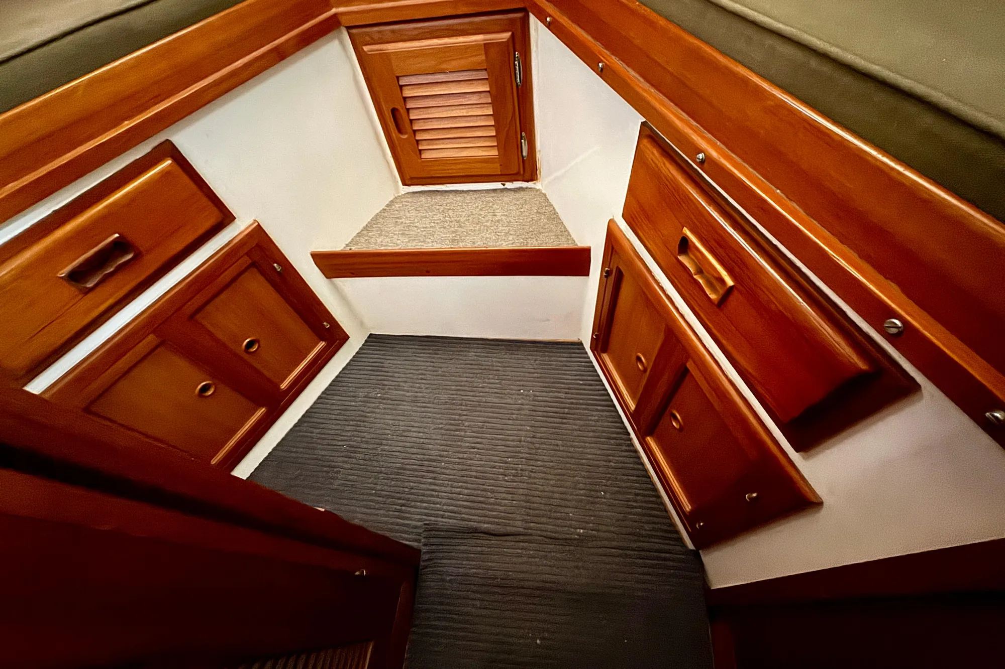 1982 Tung Hwa Seahorse interior with wooden cabinets and carpeted floor.