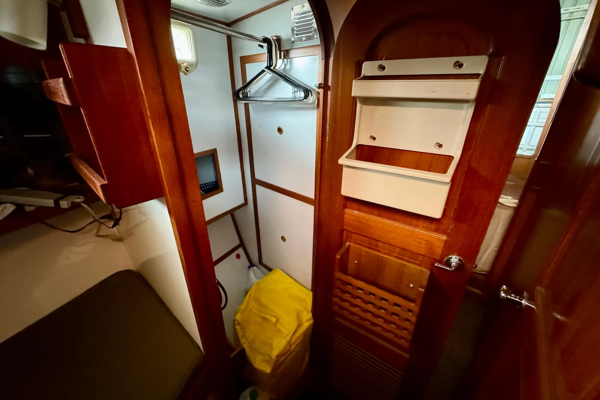 1982 Tung Hwa Seahorse yacht interior with wooden cabinetry and storage space.