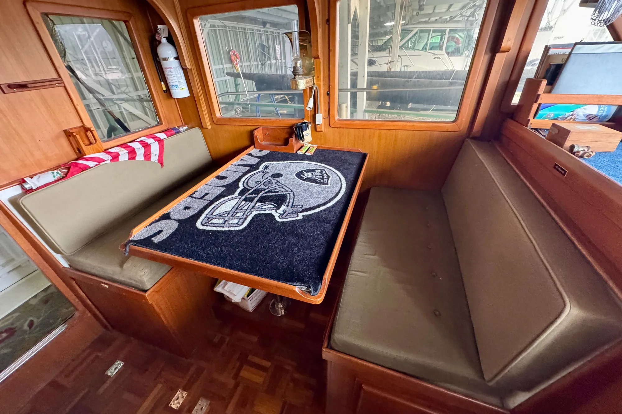 1982 Tung Hwa Seahorse boat interior with seating and table, featuring nautical decor.