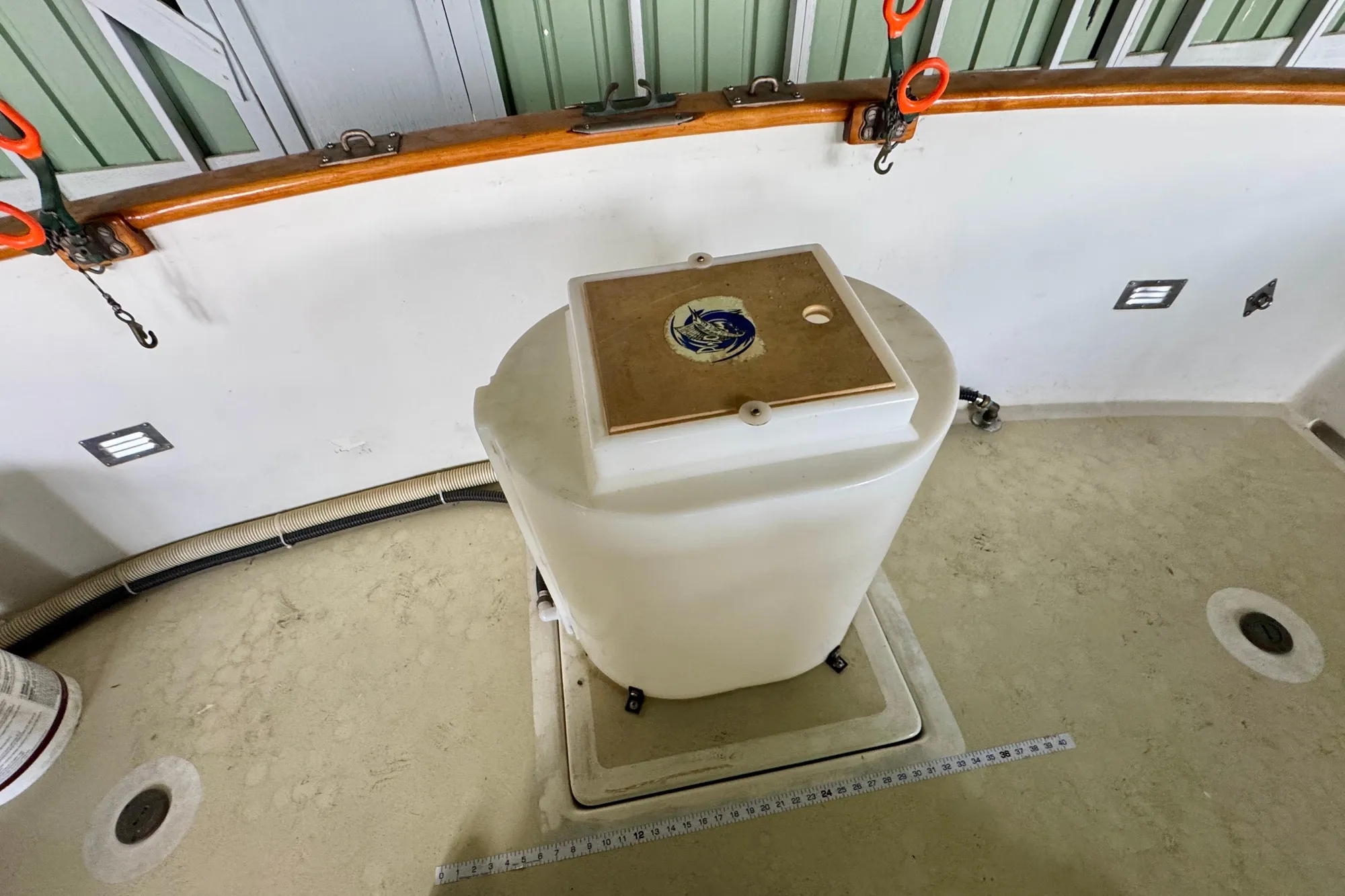 1982 Tung Hwa Seahorse boat deck with storage compartment and nautical decor.