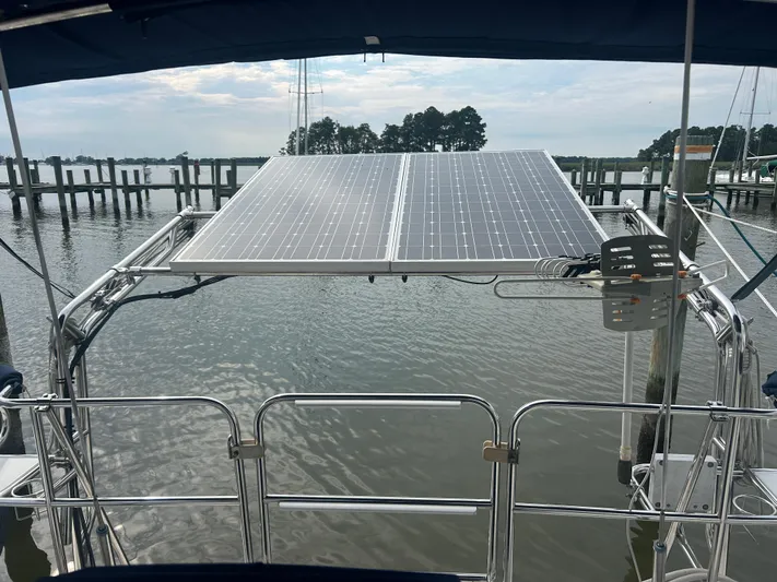 Dream Weaver Yacht Photos Pics Catalina 350 sailboat with solar panels on stern, docked at marina, 2003 model.