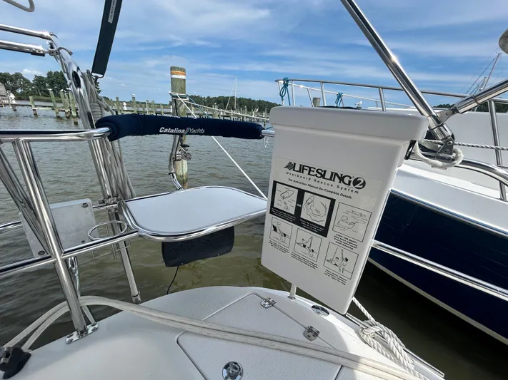 Dream Weaver Yacht Photos Pics Catalina 350 yacht with Lifesling 2 rescue system, docked by the water.