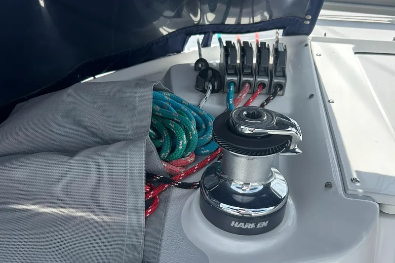 Dream Weaver Yacht Photos Pics Sailboat deck with winch, colorful ropes, and cleats on a 2003 Catalina 350.