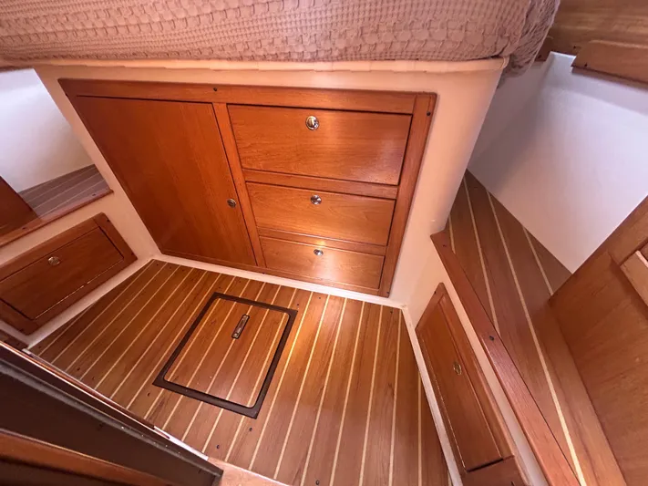 Dream Weaver Yacht Photos Pics Interior of 2003 Catalina 350 sailboat with wooden cabinetry and flooring.