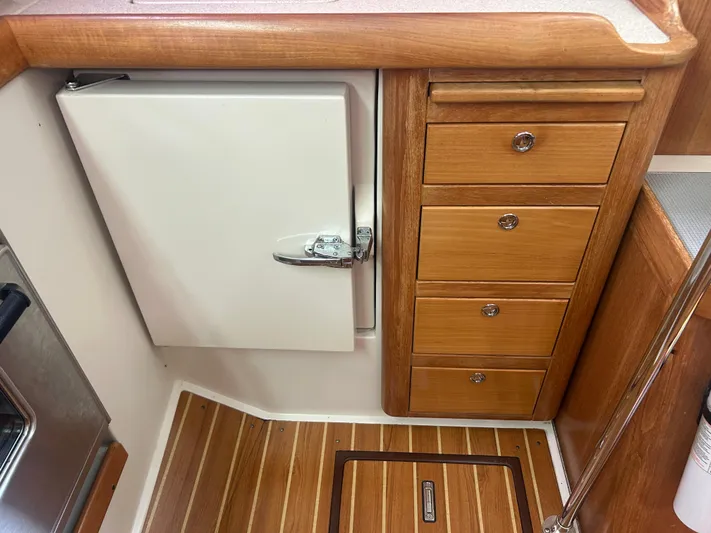 Dream Weaver Yacht Photos Pics Wooden cabinetry and flooring in 2003 Catalina 350 yacht kitchen area.