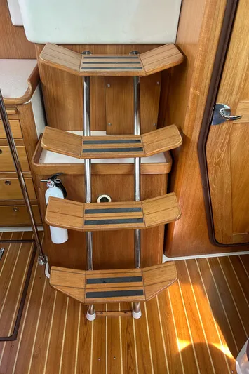 Dream Weaver Yacht Photos Pics Wooden interior stairs on a 2003 Catalina 350 sailboat.
