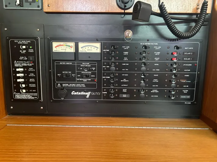 Dream Weaver Yacht Photos Pics Electrical control panel of a 2003 Catalina 350 yacht with various switches and gauges.