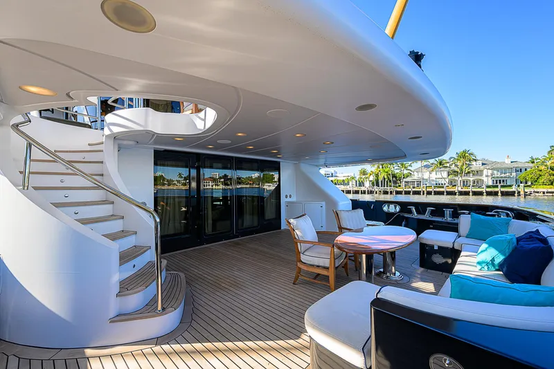 Seascape V Yacht Photos Pics Luxurious 2005 Benetti Vision 145 yacht deck with elegant seating and spiral staircase.