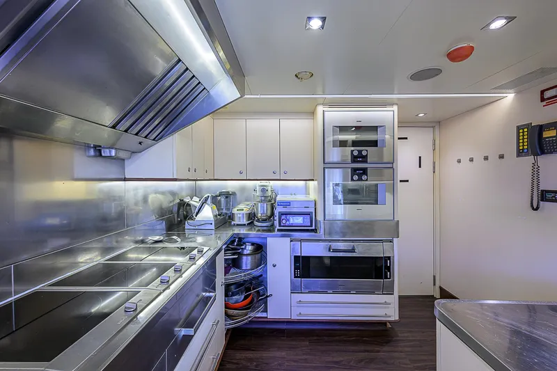 Seascape V Yacht Photos Pics Modern kitchen interior on 2005 Benetti Vision 145 yacht, featuring stainless steel appliances.