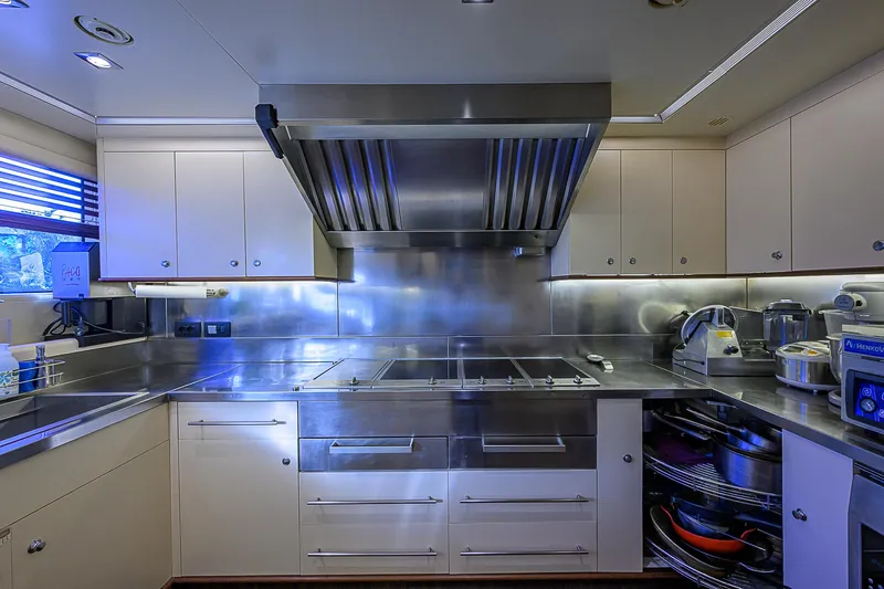 Seascape V Yacht Photos Pics Luxurious kitchen in 2005 Benetti Vision 145 yacht, featuring stainless steel appliances and modern cabinetry.