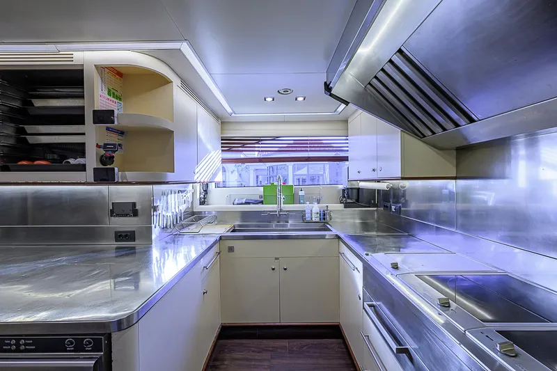 Seascape V Yacht Photos Pics Modern kitchen interior on 2005 Benetti Vision 145 yacht, featuring stainless steel surfaces.