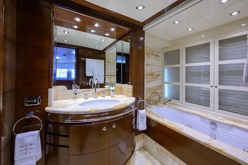 Seascape V Yacht Photos Pics Luxurious bathroom interior on 2005 Benetti Vision 145 yacht, featuring elegant wood and marble finishes.
