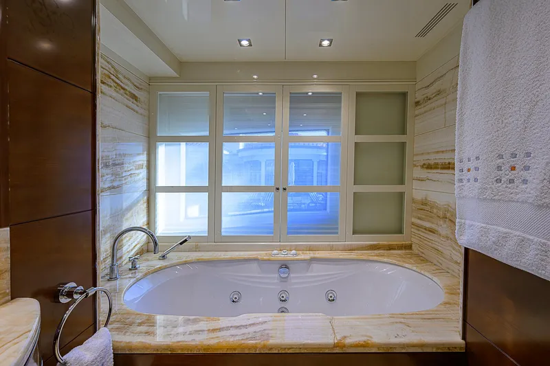 Seascape V Yacht Photos Pics Luxurious bathroom with marble jacuzzi tub on 2005 Benetti Vision 145 yacht.