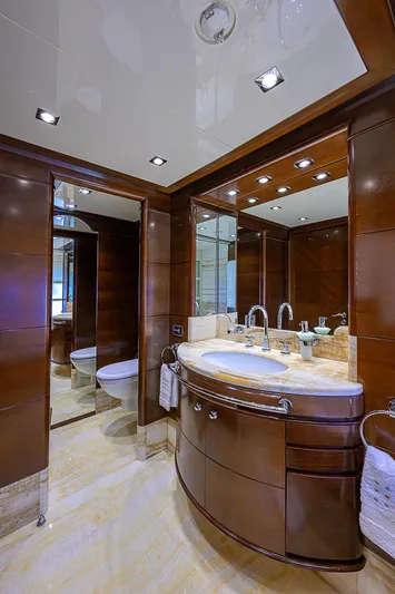 Seascape V Yacht Photos Pics Luxurious bathroom on 2005 Benetti Vision 145 yacht with elegant wood finishes and marble countertop.