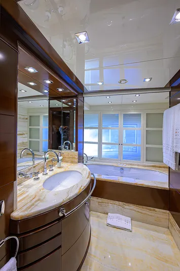 Seascape V Yacht Photos Pics Luxurious bathroom on 2005 Benetti Vision 145 yacht with elegant marble and wood finishes.