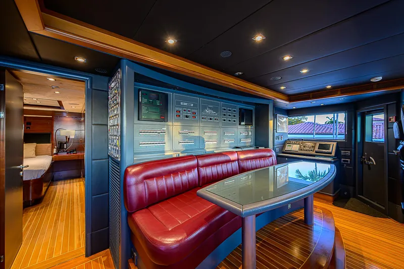 Seascape V Yacht Photos Pics Luxurious interior of 2005 Benetti Vision 145 yacht with control panels and seating area.