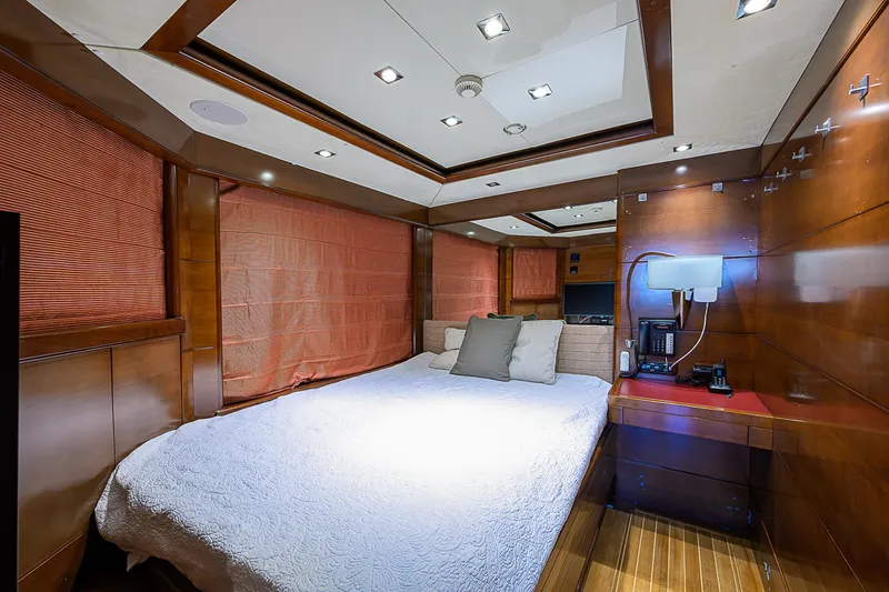 Seascape V Yacht Photos Pics Luxurious bedroom interior of 2005 Benetti Vision 145 yacht with wood paneling and modern lighting.