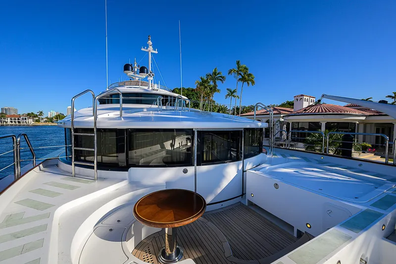 Seascape V Yacht Photos Pics Benetti Vision 145 yacht, 2005 model, docked with clear blue sky and palm trees.