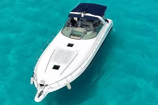 Sonata Yacht Photos Pics 1999 Sea Ray 460 Express Cruiser on clear turquoise water, aerial view.