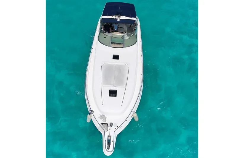Sonata Yacht Photos Pics Overhead view of 1999 Sea Ray 460 Express Cruiser on clear turquoise water.