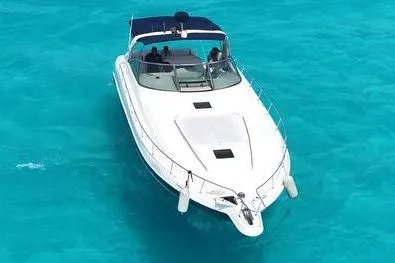 Sonata Yacht Photos Pics 1999 Sea Ray 460 Express Cruiser on clear turquoise water, aerial view.