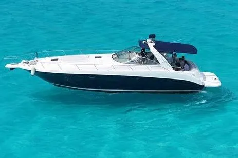 Sonata Yacht Photos Pics 1999 Sea Ray 460 Express Cruiser on clear turquoise water.