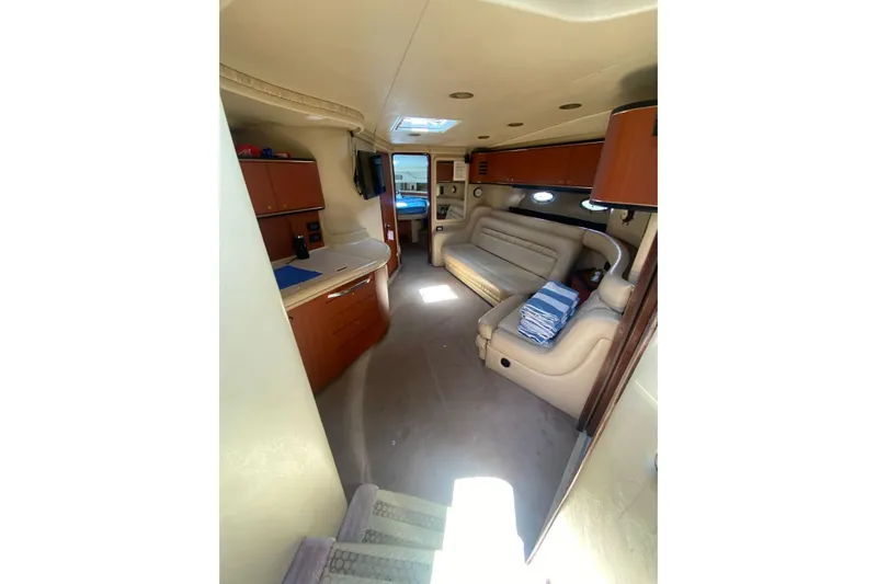 Sonata Yacht Photos Pics Interior of 1999 Sea Ray 460 Express Cruiser, featuring cozy seating and modern amenities.