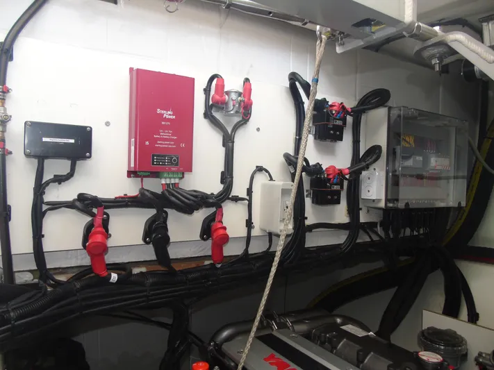 Tafika Yacht Photos Pics Electrical system setup in a 2024 Leopard 50, featuring wiring and battery charger.