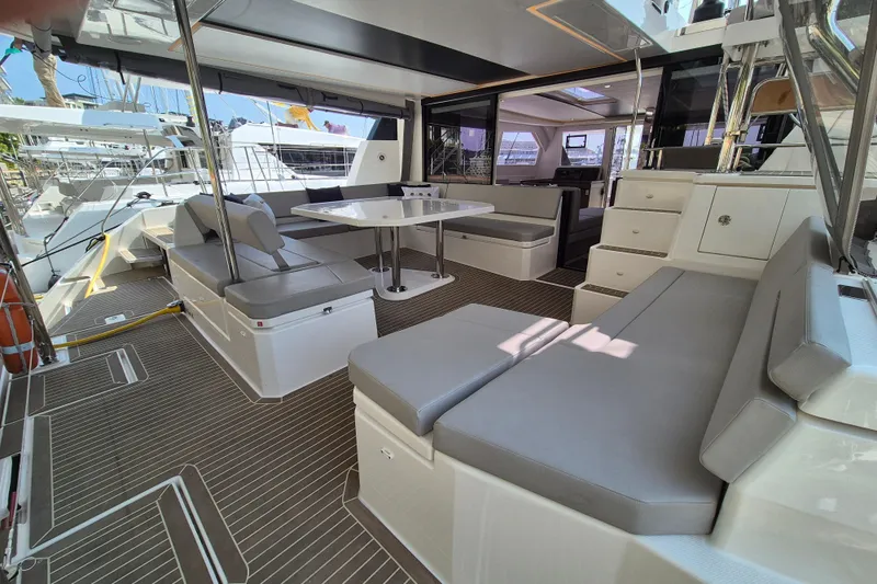 Tafika Yacht Photos Pics Luxurious 2024 Leopard 50 yacht interior with modern seating and dining area.