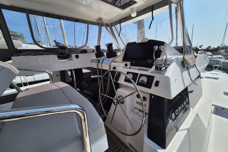 Tafika Yacht Photos Pics 2024 Leopard 50 yacht cockpit with modern navigation controls and steering wheel.