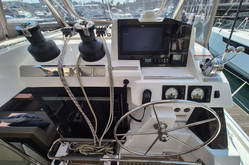 Tafika Yacht Photos Pics 2024 Leopard 50 yacht helm with navigation controls and steering wheel.