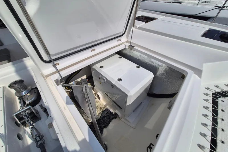 Tafika Yacht Photos Pics Open storage compartment on 2024 Leopard 50 yacht deck, featuring anchor and winch.