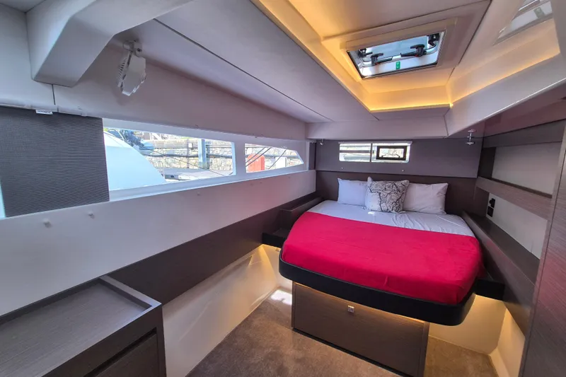 Tafika Yacht Photos Pics Luxurious 2024 Leopard 50 yacht cabin with modern design and cozy bedding.