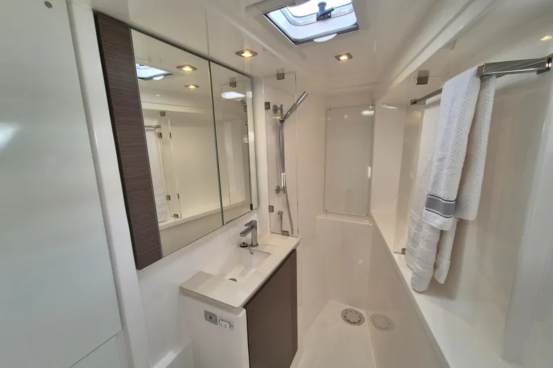 Tafika Yacht Photos Pics Luxurious bathroom in 2024 Leopard 50 yacht, featuring modern fixtures and elegant design.