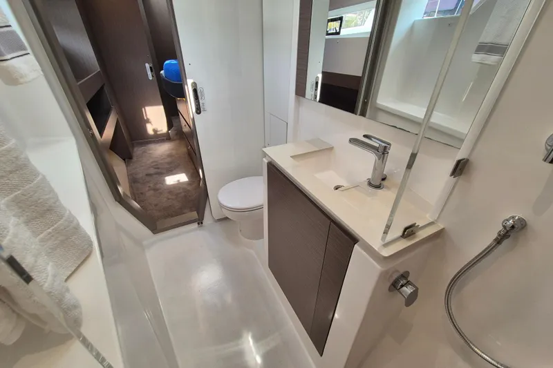 Tafika Yacht Photos Pics Modern bathroom interior on 2024 Leopard 50 yacht, featuring sleek design and fixtures.